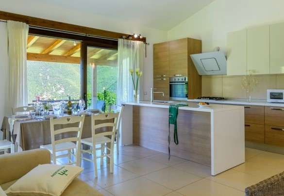 Dining area with large window overlooking the portico - Acquanera
