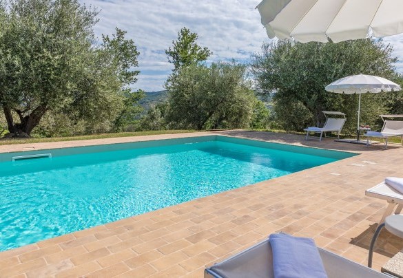 The terracotta-paved solarium houses sunbeds and umbrellas – Amandula