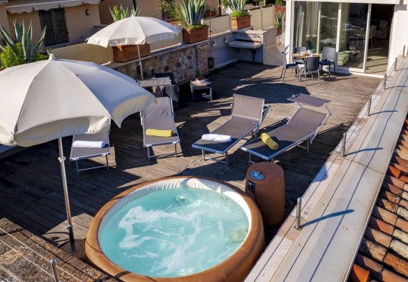 Immerse yourself in the hydromassage tub while admiring the view. .. Arcimboldo House