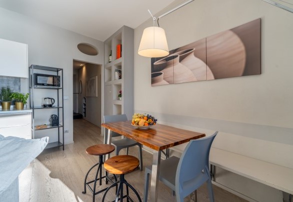 The corner of the living room with the dining table – Aurora