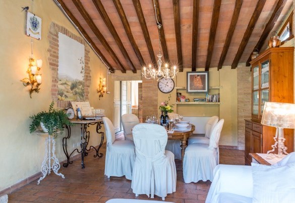 The entrance opens directly into the open-plan living area with lounge and dining room – Borgo Paradiso