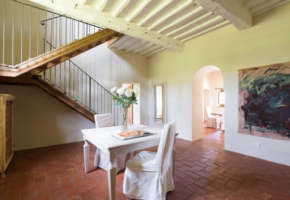 A large hallway with stairwell leading up to the first floor – Ca Maggiore