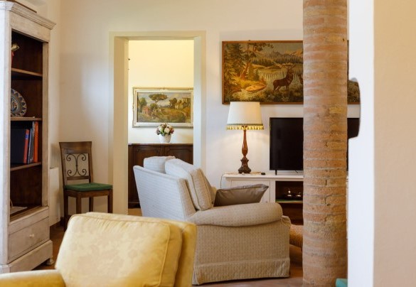 Living room is furnished in a refined style – Ca’ Pellicciano
