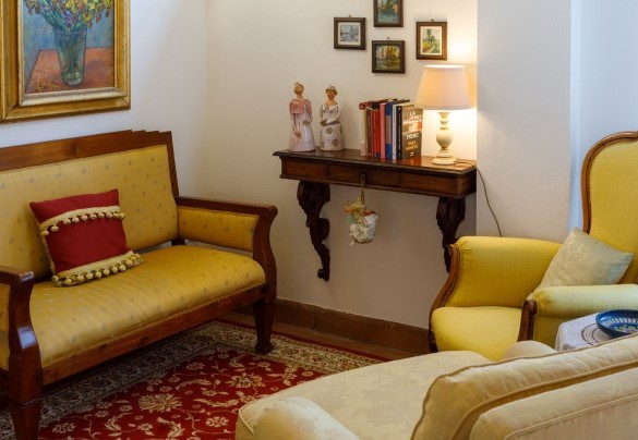 Living room is furnished in a refined style – Ca’ Pellicciano