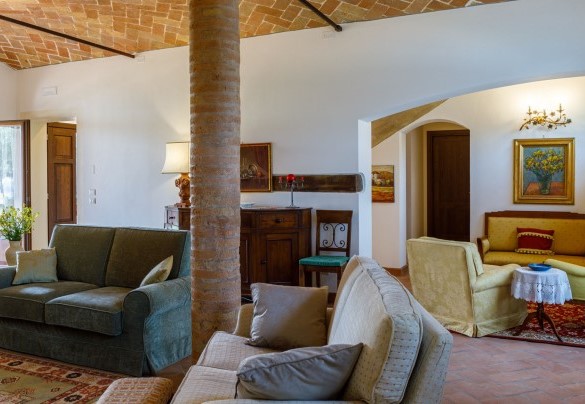Living room is furnished in a refined style – Ca’ Pellicciano
