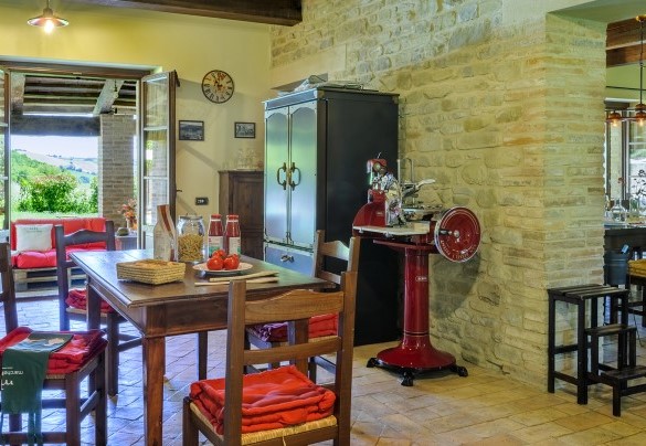 Kitchen with table, slicer and countryside view - Ca Seppe