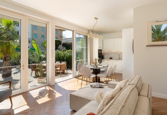 The open-plan kitchen and living room with TV – Casa Amare