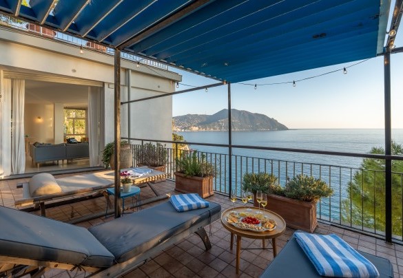 Armchairs, sun loungers and tables complete the terrace furnishings – Casa Chiara