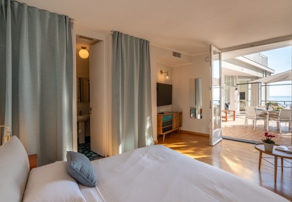 From the terrace, a French window leads into independent double bedroom no. 4, equipped with a small living area  – Casa Chiara