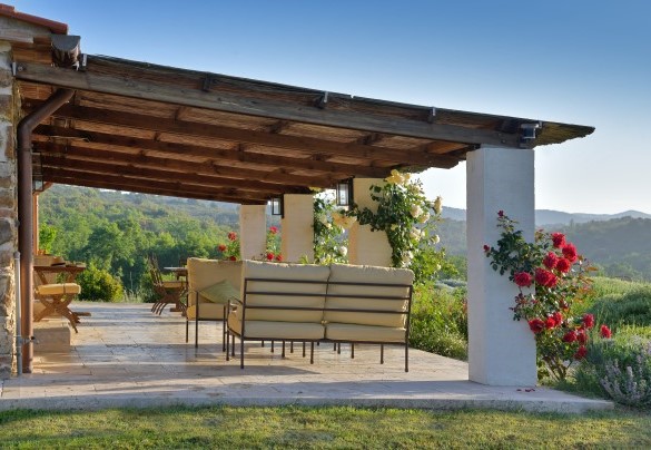 The tiled area where a lounge and outdoor dining area have been set up – Casa La Pratellaccia