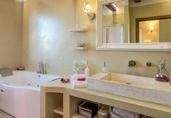 The characteristic bathroom with a whirlpool tub and shower - Casale Bella Vita