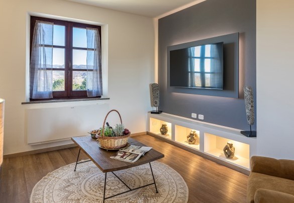The design living room with a TV - Casale Bella Vita