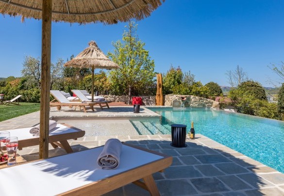 The sunbathing area surrounds the pool - Casale Bella Vita
