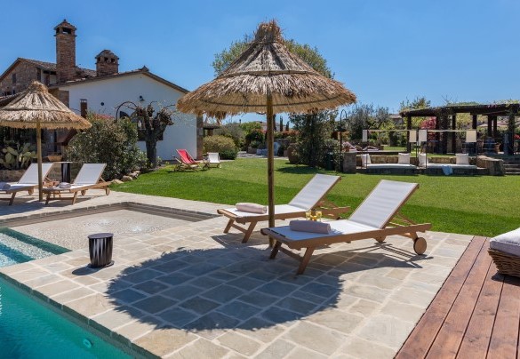 The sunbathing area surrounds the pool - Casale Bella Vita