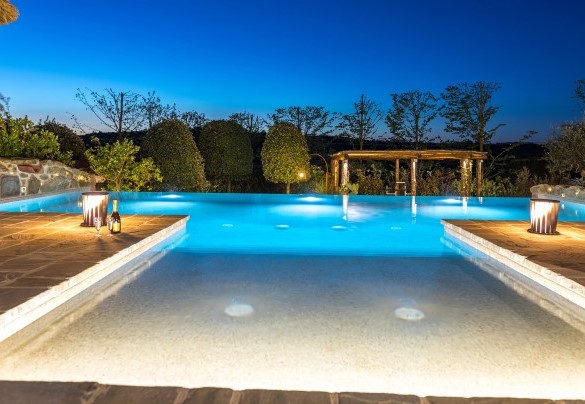 The pool's internal lights create an enchanting atmosphere - Casale Bella Vita