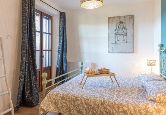 The uniquely styled master bedroom on the first floor - Casale Bella Vita