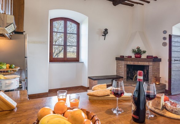 The kitchen with convenient exit to the outdoor dining area - Casale Le Tre Querce