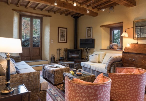 The cozy living room open with fireplace  - Casale Mollina