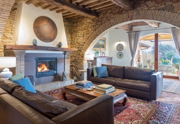 The cozy living room open with fireplace - Casale Santa Lucia