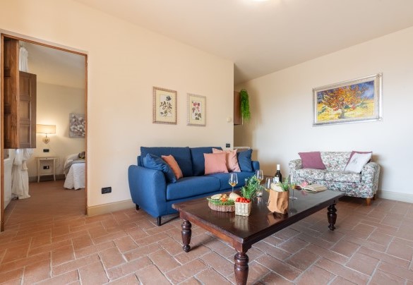 The living room with French door and panoramic view on the ground floor- Casale Teatro