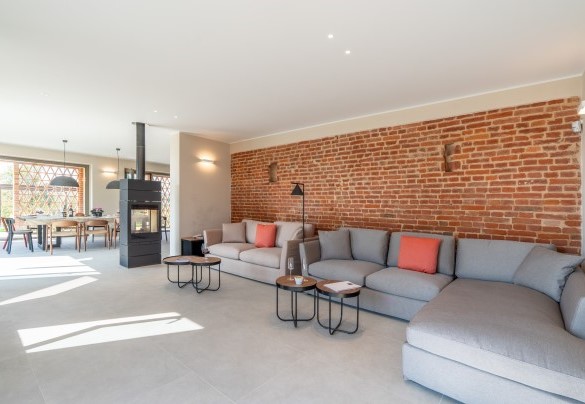 The living area with the  large wood-burning stove – Cascina Buzio