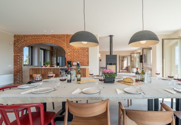 The open-plan kitchen overlooks the dining area – Cascina Buzio