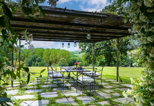 A beautiful gazebo equipped dining area is located right in front of the exit of the kitchen - Cascina Moglia