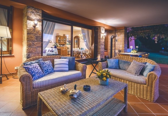 The elegantly furnished porch is equipped to enjoy moments of relaxation- Corazza