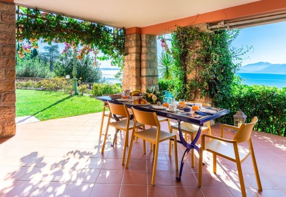 The elegantly furnished porch is equipped to enjoy moments of relaxation- Corazza