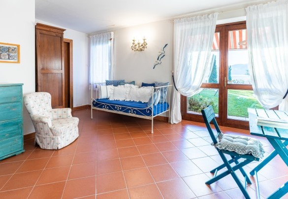 The double bedroom with an additional single sofa bed and en-suite bathroom - Corazza