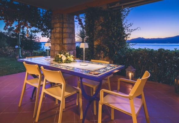 The elegantly furnished porch is equipped to enjoy moments of relaxation- Corazza