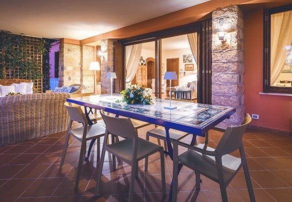 The elegantly furnished porch is equipped to enjoy moments of relaxation- Corazza