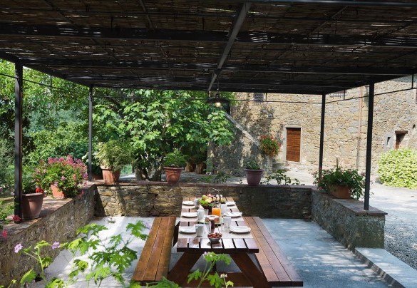 The outdoor table located under a pergola only few steps far from the villa – Crognole 