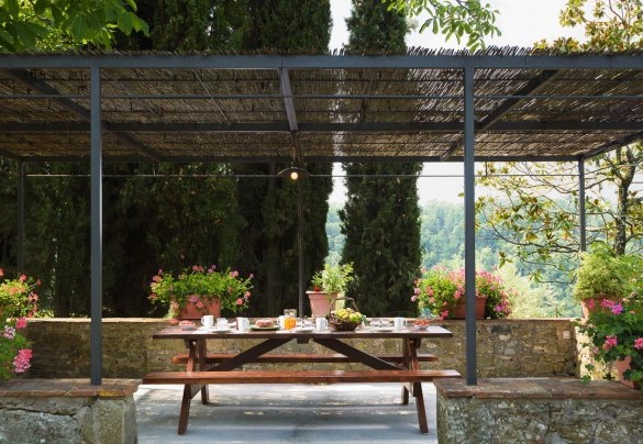 Beautiful flowers embellishing the pergola with outdoor dining area – Crognole 
