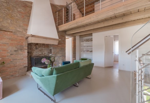 The fireplace is the centerpiece of the living room - Dimora Montefiore