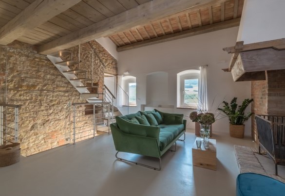 The fireplace is the centerpiece of the living room - Dimora Montefiore