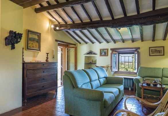Living room on the first floor of the Farmhouse with direct access outside with external staircase and internal staircase
