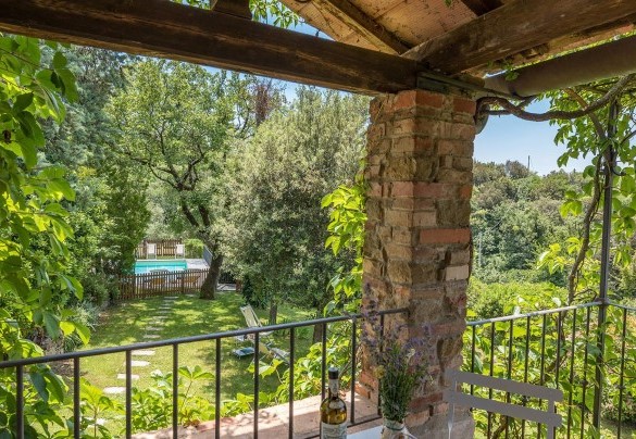The loggia equipped with table and chairs with a splendid view of the countryside