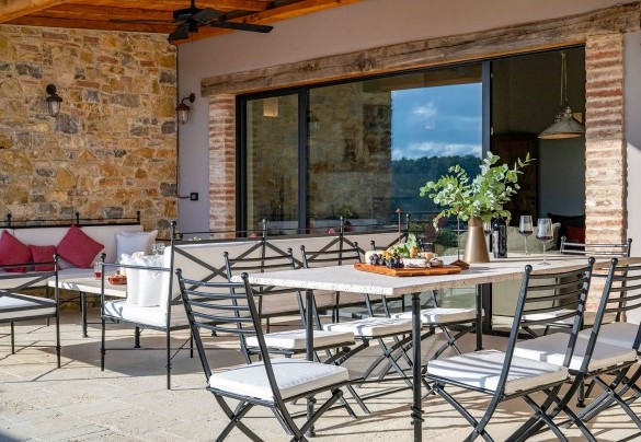 The shaded terrace overlooking the pool with the dining and living areas - I Tramonti
