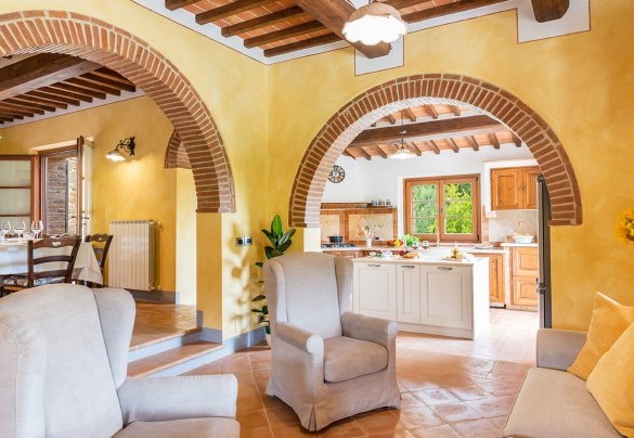 living room on the ground floor with a fireplace and TV - Il Casale Di Manuele