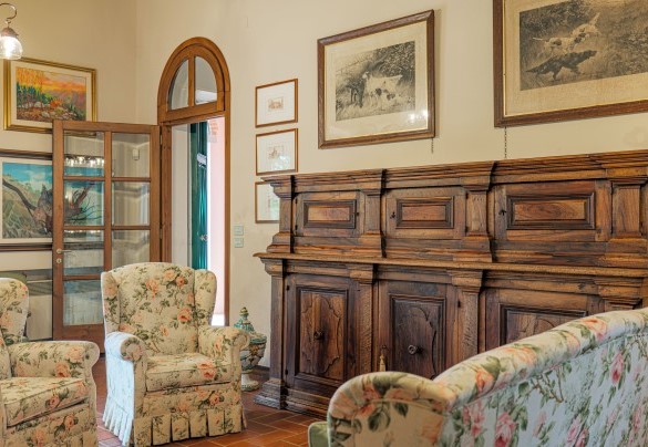 The main living room with TV, billiard table and fireplace (ornamental) on the ground floor – Il Cerreto