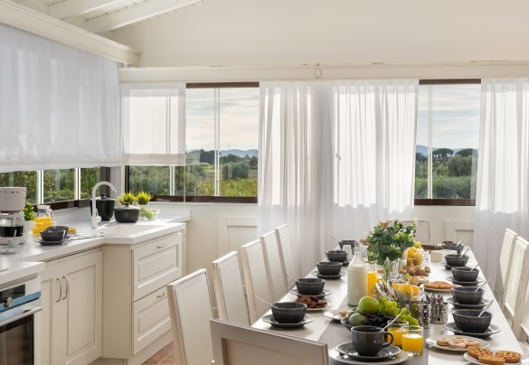 open space kitchen equipped and dining table on the first floor - La Buganvilla