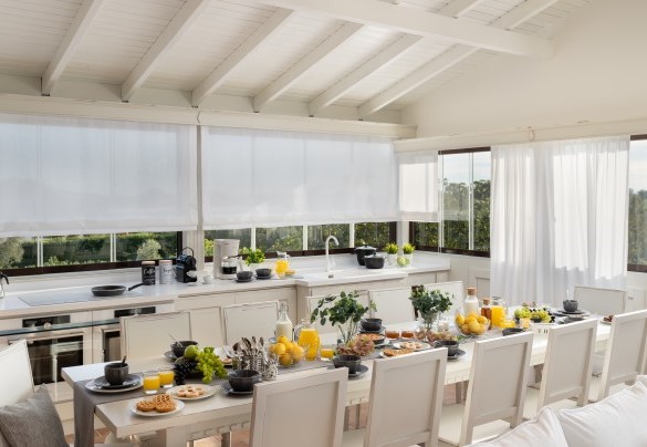 open space kitchen equipped and dining table on the first floor - La Buganvilla