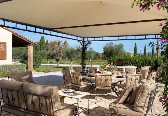 Natural stone dining table and lounge under the gazebo - La Buganvilla