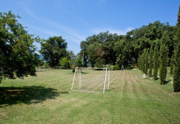 There is a playgroud area situated a few metres from the entrance gate, shaded by ancient oak trees, with a private five-a-side football field - La Colonica  