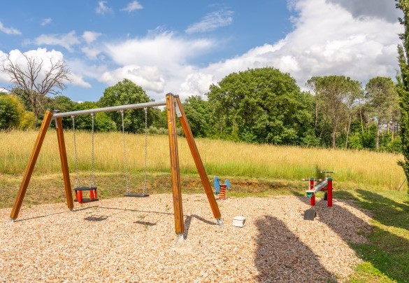 There is a playgroud area situated a few metres from the entrance gate, shaded by ancient oak tree - La Colonica
