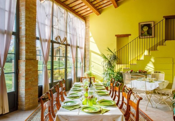 Large brightly-lit veranda characterized by expansive glass walls – La Tana del Ghiro