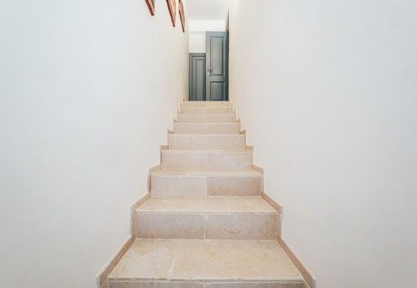The stone staircase leading to the upstairs rooms - La Torre di Monsignore