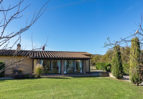 The veranda with the dining area and french doors to the garden- La Vigna
