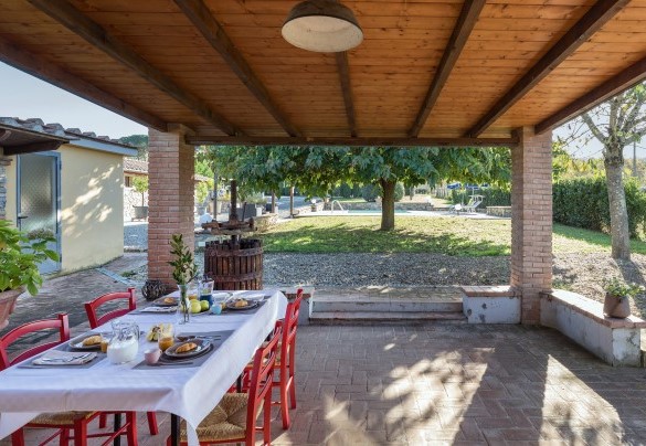 A dining area has been set up in the loggia in front of the main entrance- La Vigna